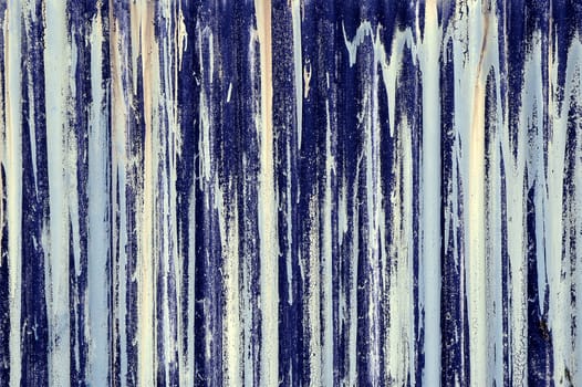 random blue streaks abstract on a corrugated iron barricage