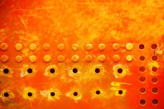 industrial grunge background of sunburst metal rivets