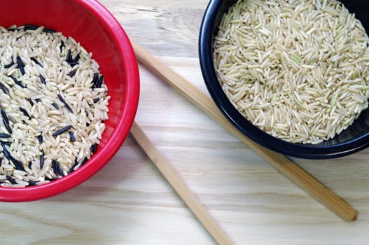 Basmati rice in Red and Black rice bowls with Chopsticks