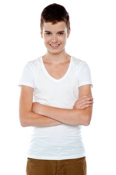 Smiling boy posing with crossed arms isolated on white background