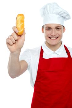 Its time for some yummy hot dog. Chef showing bread before baking it