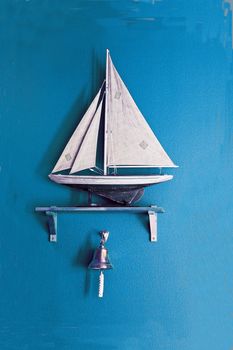 Sailboat on the blue wall background