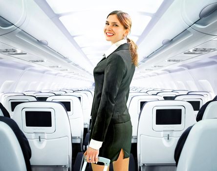 beautiful flight attendant on board of big plane