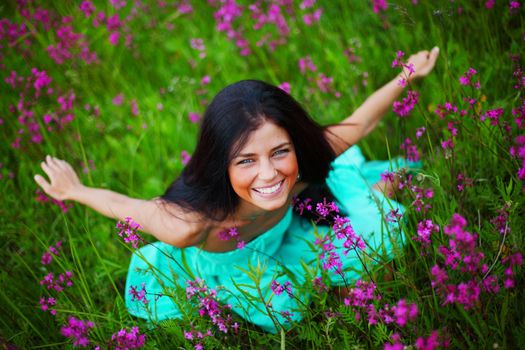woman on summer flower field