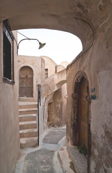 Emporio village street with staircases and entrance doors in Santorini island