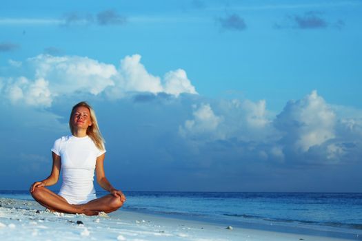 yoga woman on sea coast