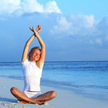 yoga woman on sea coast