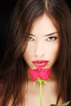 Pretty black hair woman and red rose