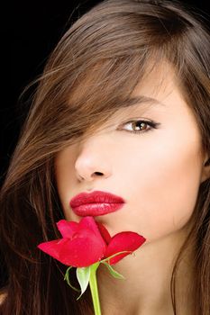 Pretty black hair woman and red rose