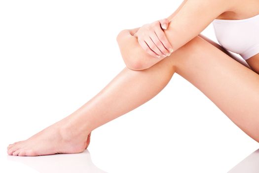 Legs and part of a female body, isolate on white background
