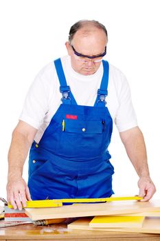 Middle age worker measuring the panel, boards, isolated on white background