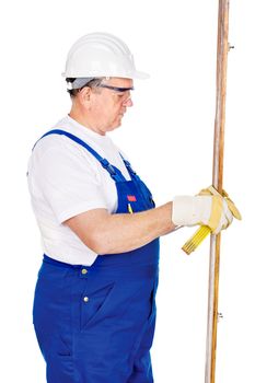 Middle age worker measuring the boards, isolated on white background