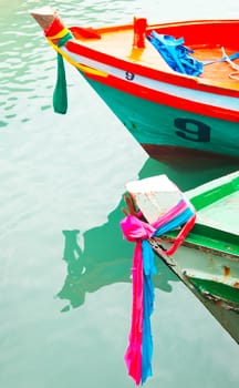 Colorful fabric binding at front view of boats