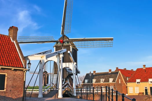Bascule bridge and  windmill at sunset. Heusden. Netherlands