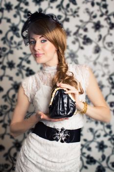 Glamorous retro-styled woman with handbag