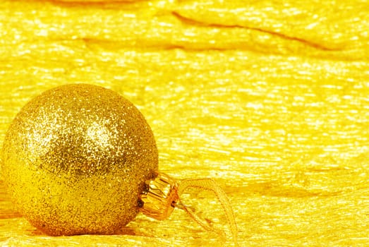 Christmas ball on golden background