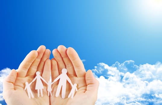 Paper family in hands isolated on white background