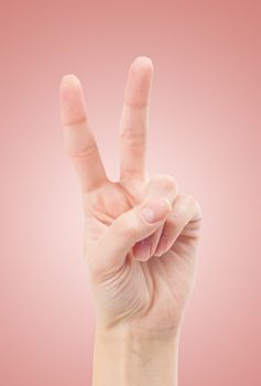 Hand with two fingers up in the peace or victory symbol. Also the sign for the letter V in sign language.
