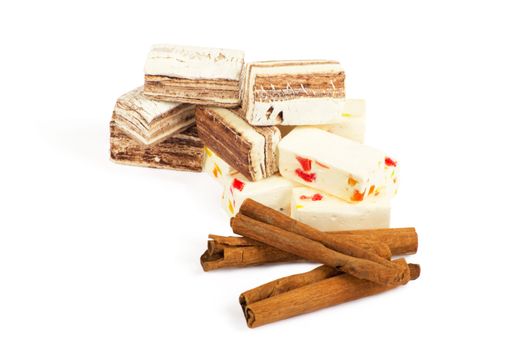 Closeup of sweets and cinnamon over white