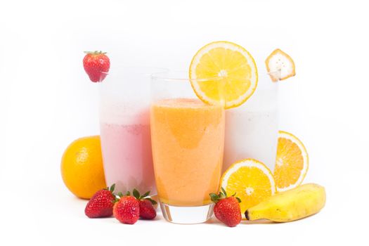 3 different juices and vitamins (strawberry, orange and banana) isolated on a white background.