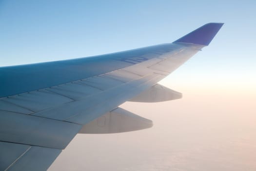 Sunrise with Airplanes wing from its windows