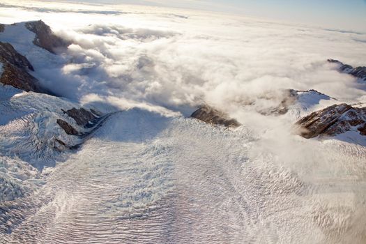 aerial view of franz josef glacier from helicopter in New Zealand Sunset