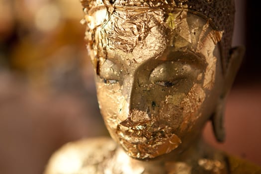 Image buddha in the gold wall background