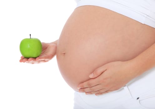 Pregnant woman holding fine green apple. All on white background.