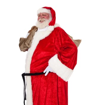 Santa Claus in authentic look carrying bag of presents. All on white background.