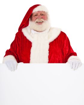 Santa Claus in authentic look behind blank white sign. All on white background.