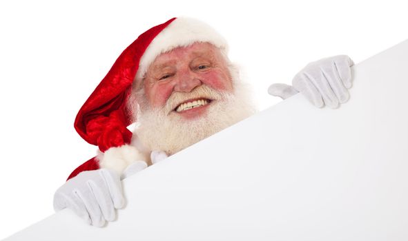 Santa Claus in authentic look behind blank white sign. All on white background.