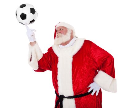 Santa Claus in authentic look playing with soccer ball. All on white background.