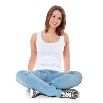 Full length shot of a young woman sitting on the floor. All on white background.