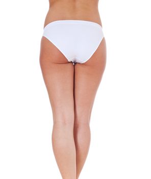 Attractive buttocks of a female person. All on white background.
