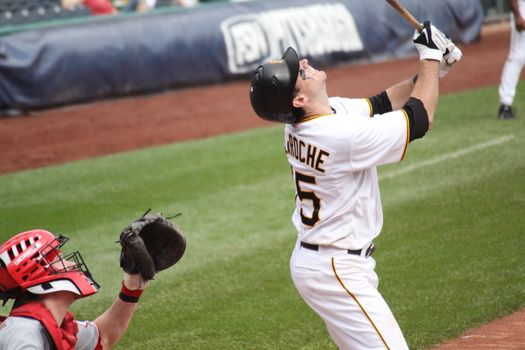 PITTSBURGH - SEPTEMBER 24 : Andy LaRoche of the Pittsburgh Pirates swings at a pitch against Cincinnati Reds on September 24, 2009 in Pittsburgh, PA.