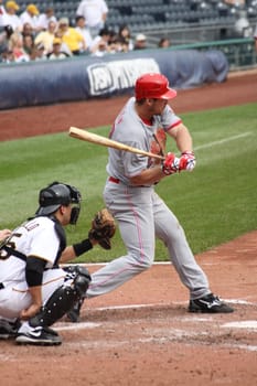 PITTSBURGH - SEPTEMBER 24: Scott Rolen of the Red swings hard during a games against the Pittsburgh Pirates on September 24, 2009 in Pittsburgh, PA.