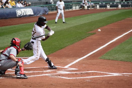 PITTSBURGH - SEPTEMBER 24 : Andrew McCutchen of the Pittsburgh Pirates swings against Cincinnati Reds on September 24, 2009 in Pittsburgh, Pa.