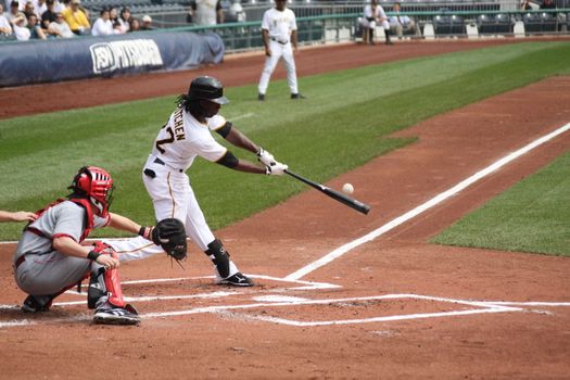 PITTSBURGH - SEPTEMBER 24 : Andrew McCutchen of the Pittsburgh Pirates hits the ball against Cincinnati Reds on September 24, 2009 in Pittsburgh, Pa.