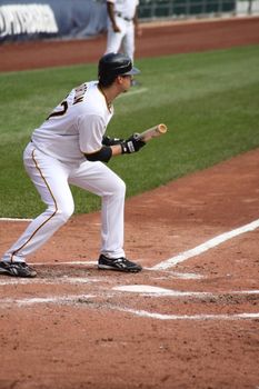 PITTSBURGH - SEPTEMBER 24 : Charlie Morton of the Pittsburgh Pirates lays down the bunt in a game against Cincinnati Reds on September 24, 2009 in Pittsburgh, PA.