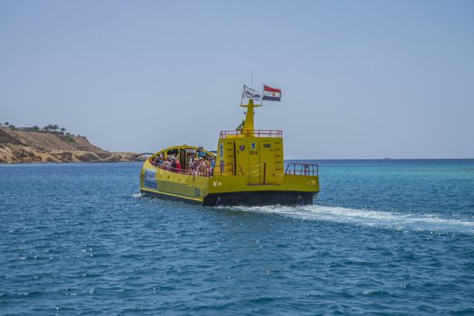 Boats that sail over the coral reefs in the bay of Sharm el Sheikh, Egypt. The picture is shot one day in April 2013.