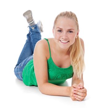 Full length shot of an attractive young woman lying on the ground. All on white background.