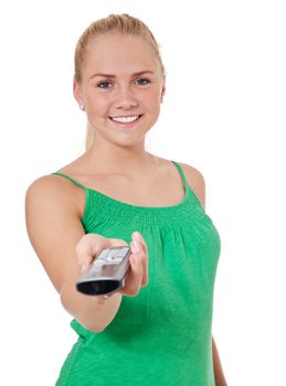 Attractive teenage girl hands over telephone. All on white background.
