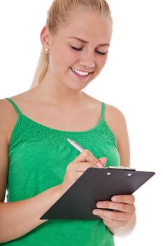 Attractive teenage girl filling out questionnaire. All on white background.