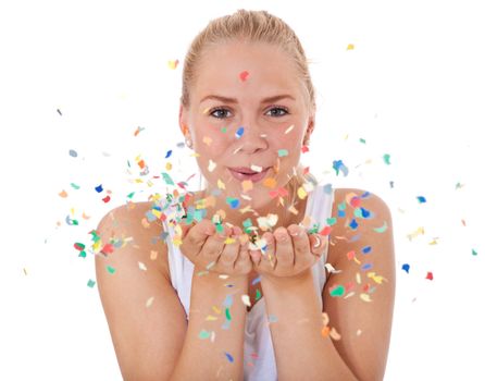 Attractive teenage girl having fun with confetti. All on white background.