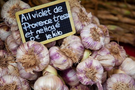 Fresh garlic on provencal market stall.