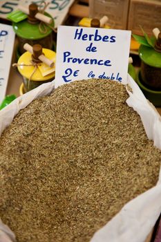 Bag of provencal herbs at market stall.