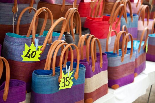 Stall offering colorful bags.