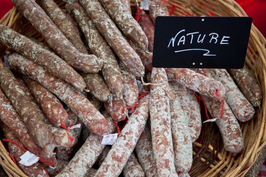 Fine air-dried sausages at market stall.