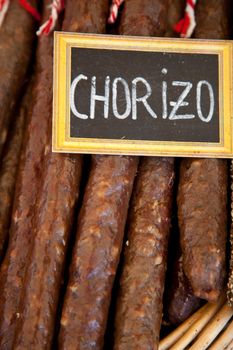 Traditional chorizo sausage at market stall.