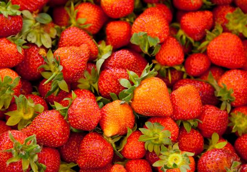 Fine ripe strawberries background texture.